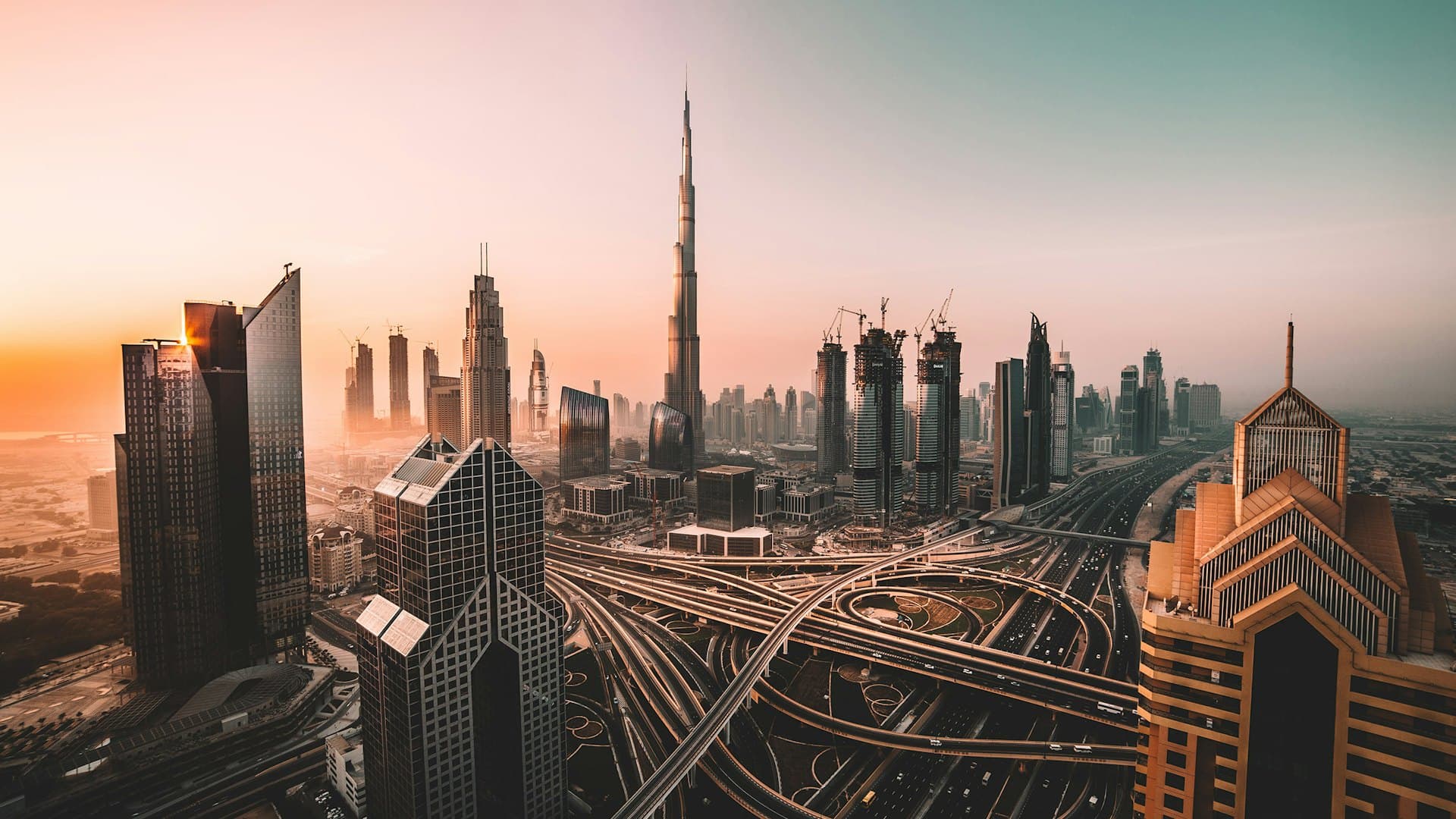 Gulf city skyline of commercial and residential towers at first light